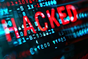 Detailed view of a computer screen with the word "HACKED" displayed prominently