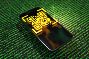 Yellow QR code floating above a smartphone on a green background made of computer programming language codes Illustration of the concept of QR code scam, hacking and electronic payment security