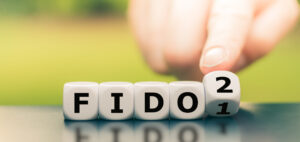 Hand turns a dice and changes the expression "FIDO" to "FIDO"